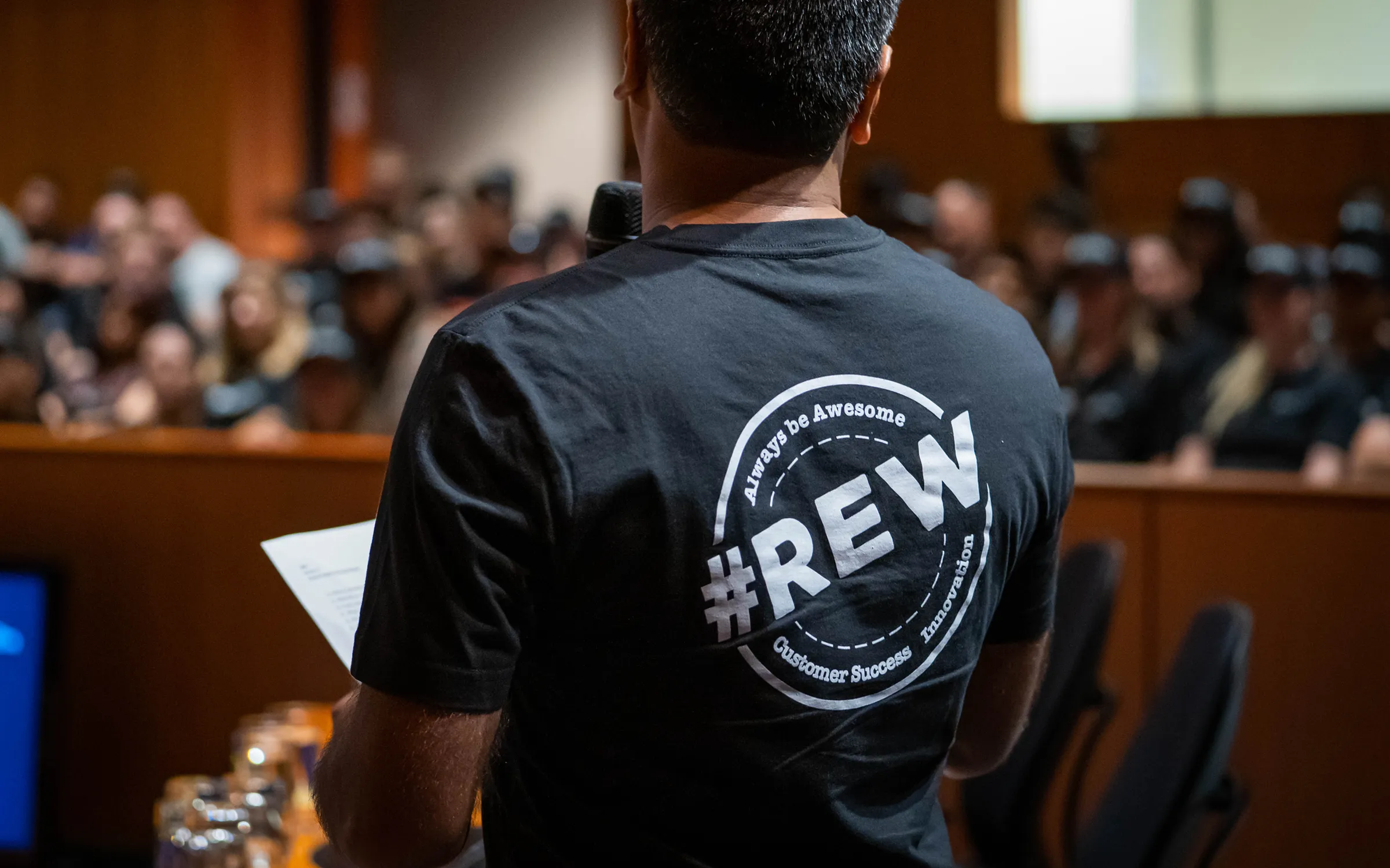 REW Town Hall 2019 - Aayaam Kapoor wearing REW t-shirt with core values